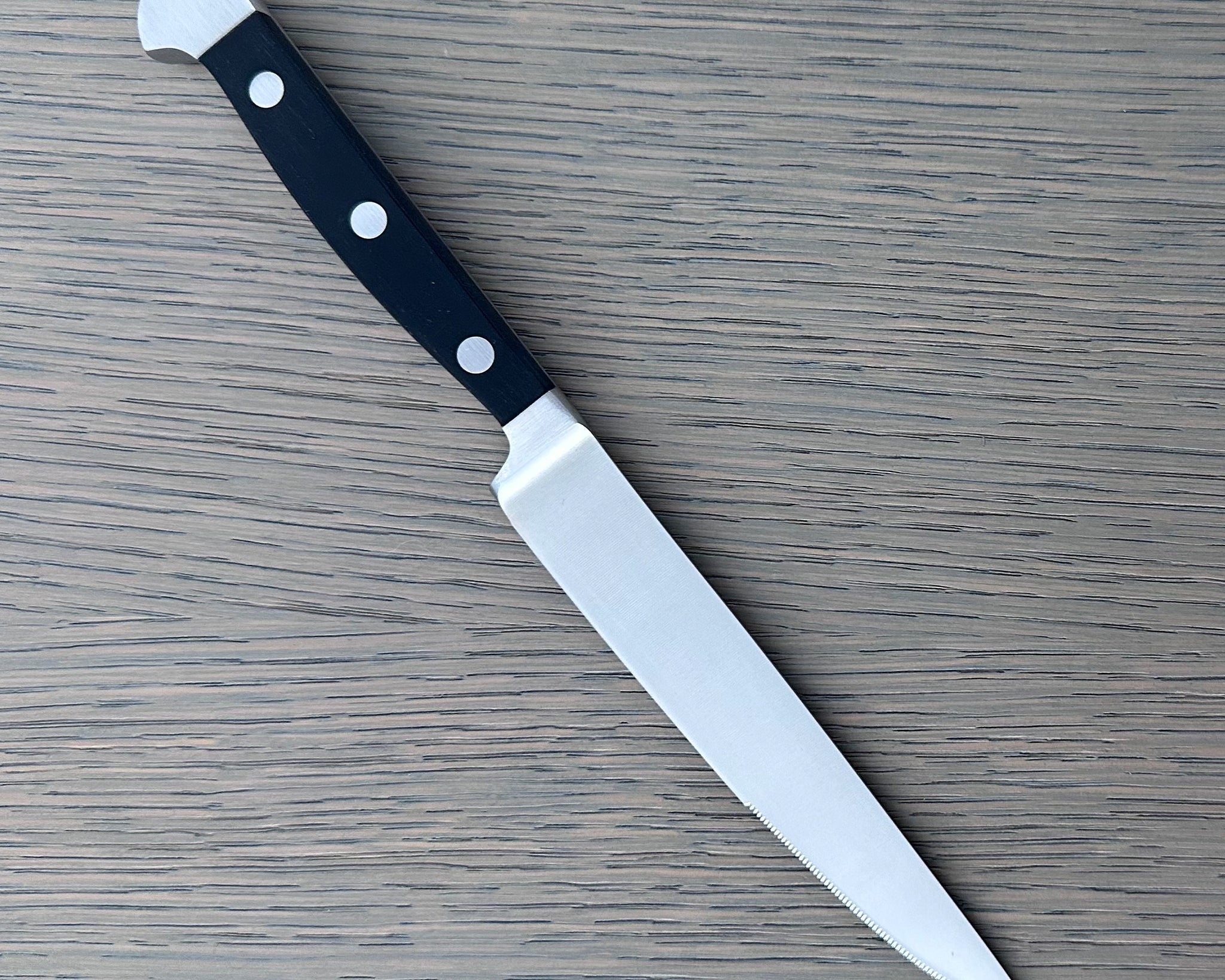 Gude Alpha Series Forged Double Bolster Porterhouse Serrated Steak Knife 4-1/2-in, Black Hostaform Handle – Gude Shop USA