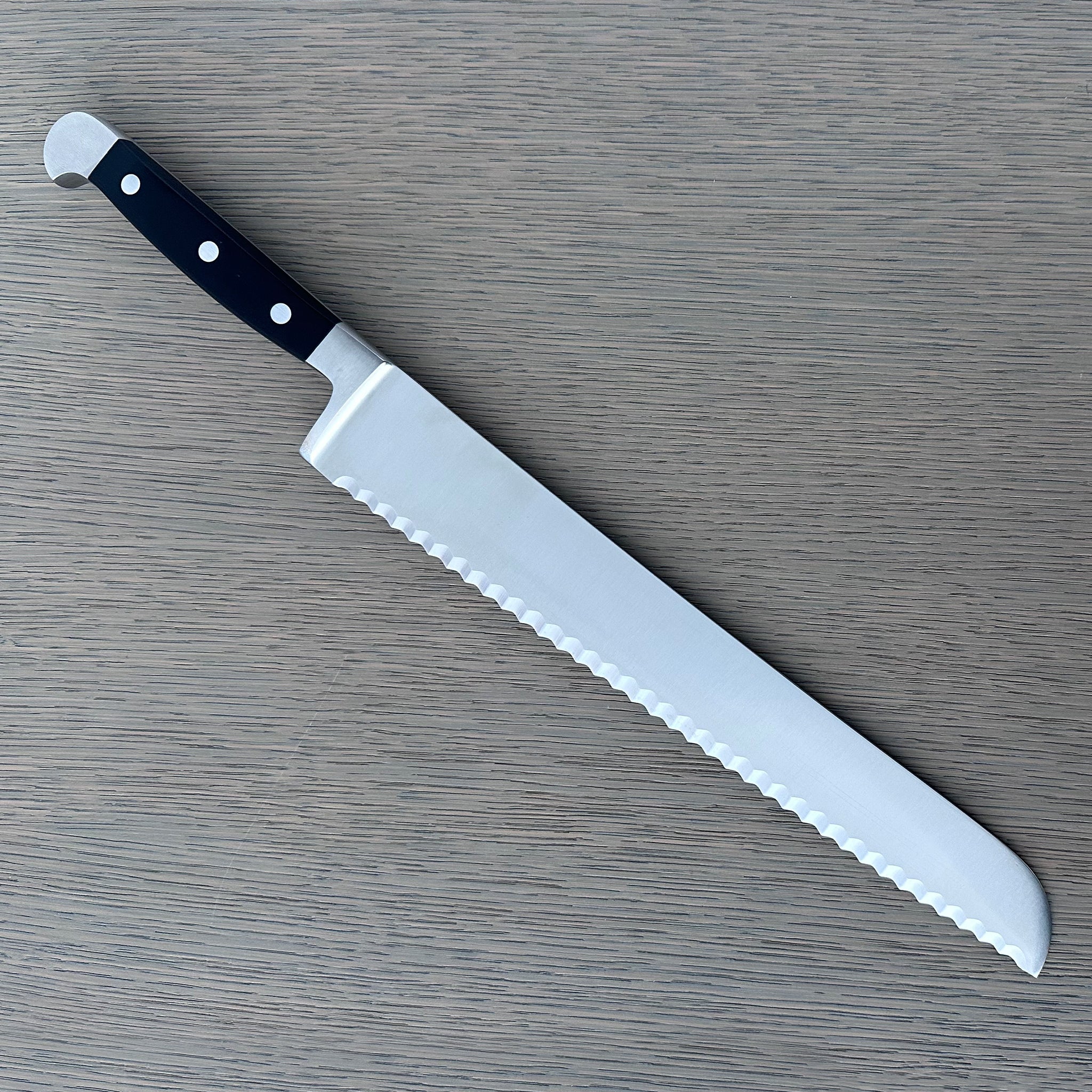 Gude Alpha Series Forged Double Bolster Serrated Bread Knife 12-in, Black Hostaform Handle – Gude Shop USA