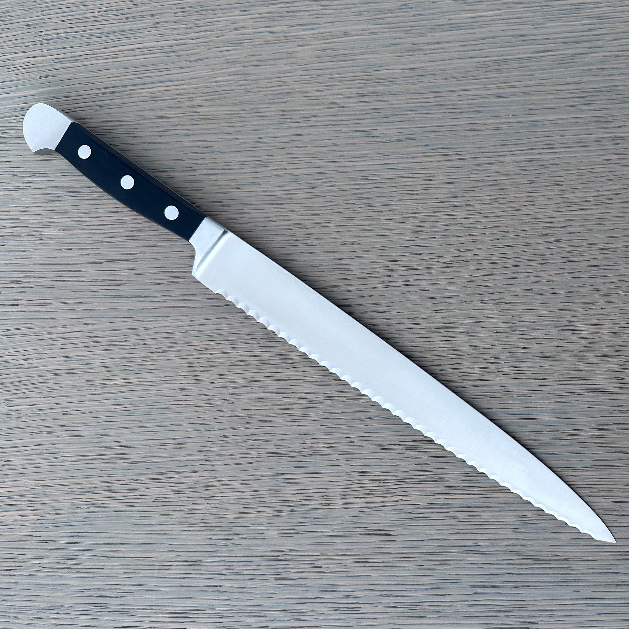 Gude Alpha Series Forged  Double Bolster Serrated Slicer / Roast Beef Knife 10-in, Black Hostaform Handle – Gude Shop USA