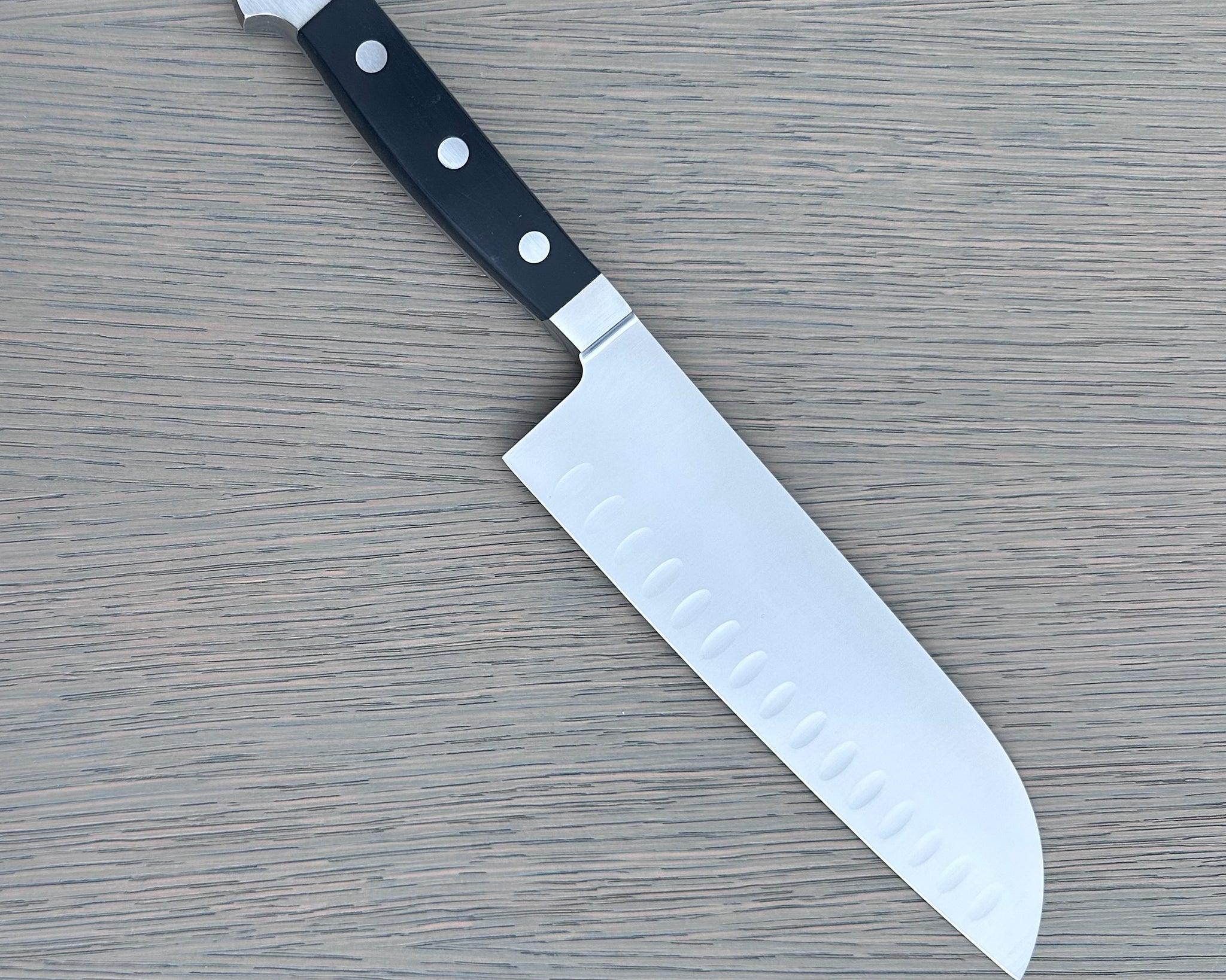 Gude Alpha Series Forged Double Bolster Hollow Edge Santoku Knife 7-in, Black Hostaform Handle – Gude Shop USA