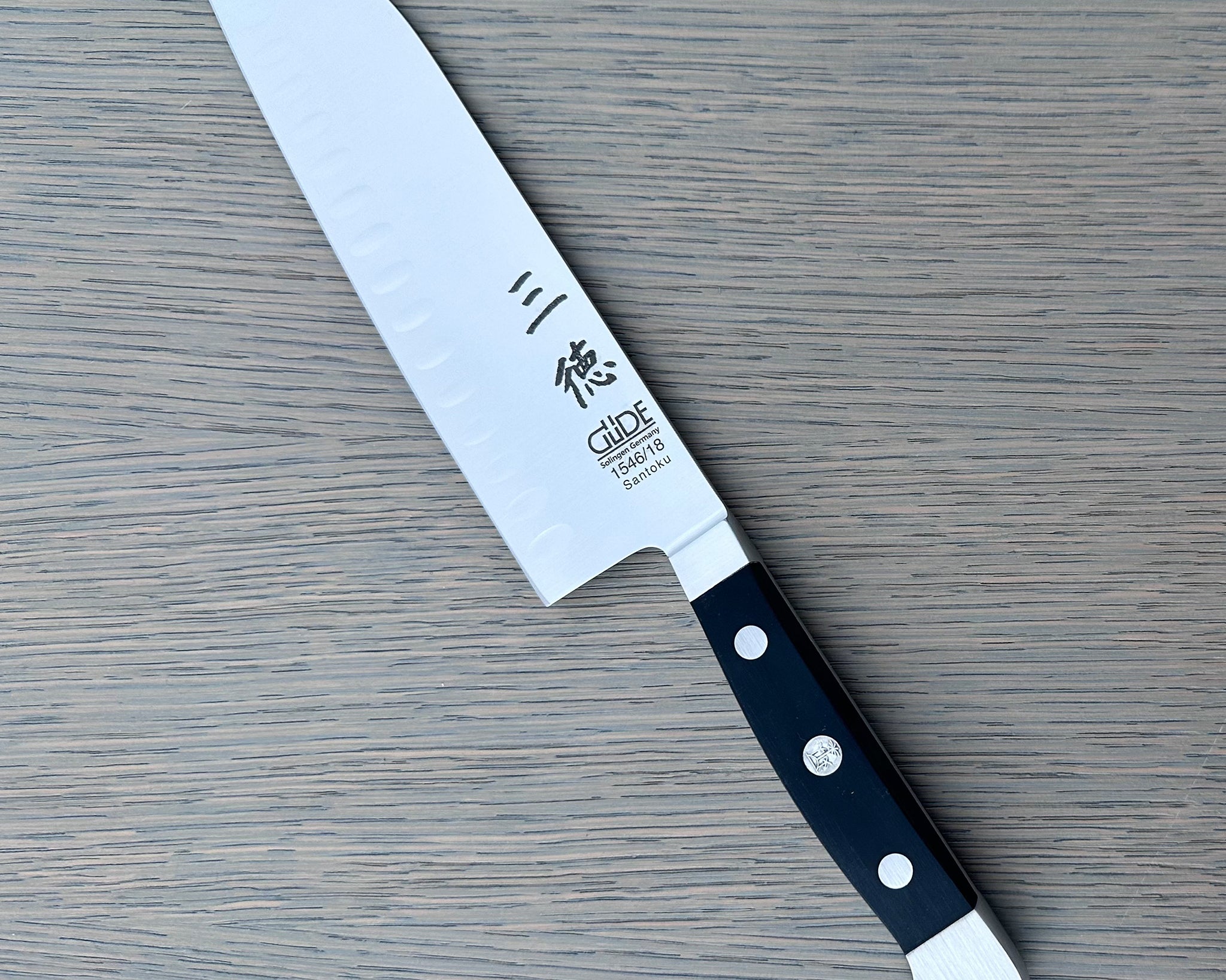 Gude Alpha Series Forged Double Bolster Hollow Edge Santoku Knife 7-in, Black Hostaform Handle – Gude Shop USA