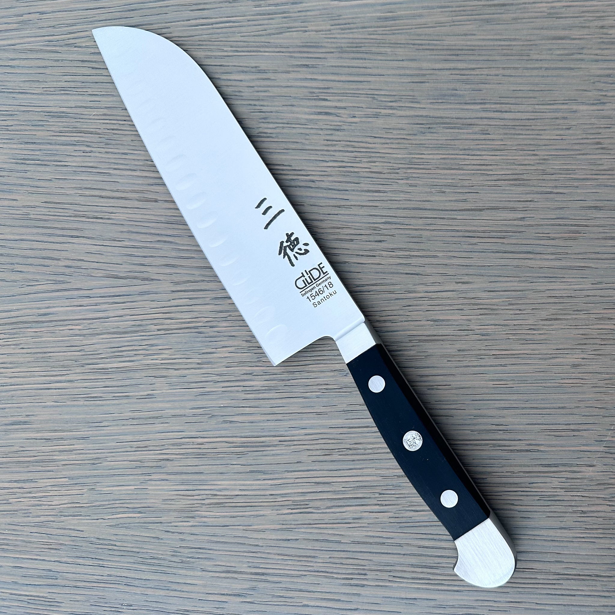 Gude Alpha Series Forged Double Bolster Hollow Edge Santoku Knife 7-in, Black Hostaform Handle – Gude Shop USA