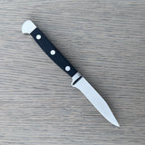 Güde Alpha Series 3-inch Sharp Point paring knife with a pointed tip and black Hostaform handle