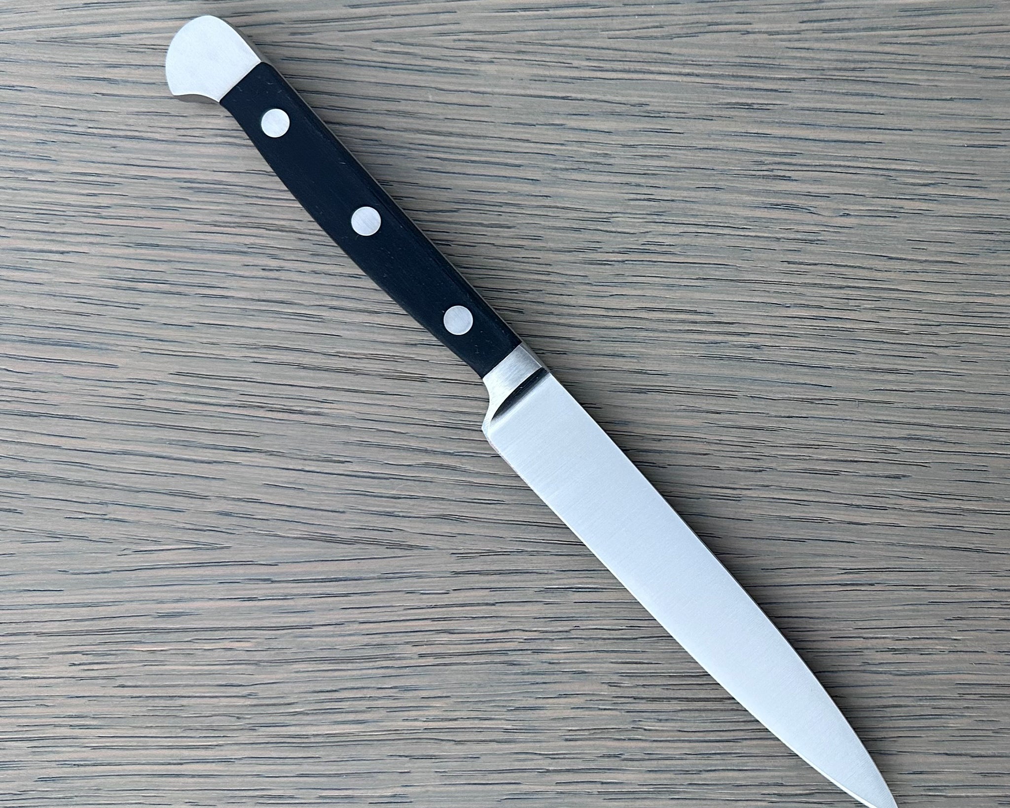 Güde Alpha Series 5-inch Utility Knife, forged blade and black Hostaform handle for daily prep