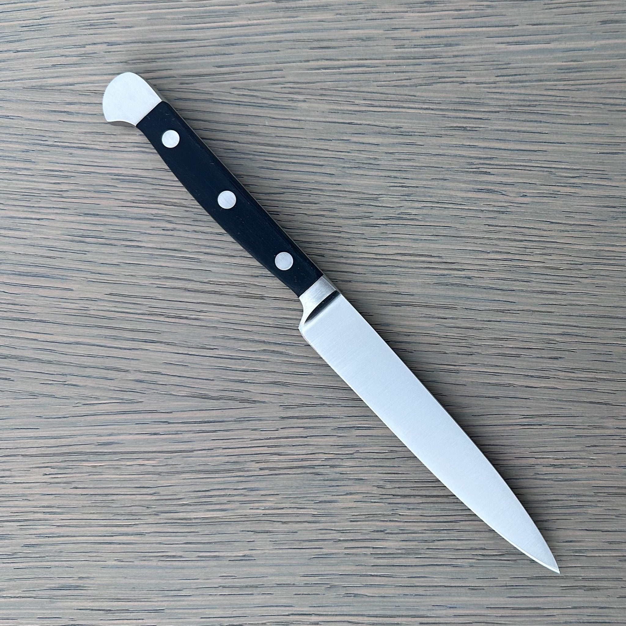 Güde Alpha Series 5-inch Utility Knife, forged blade and black Hostaform handle for daily prep