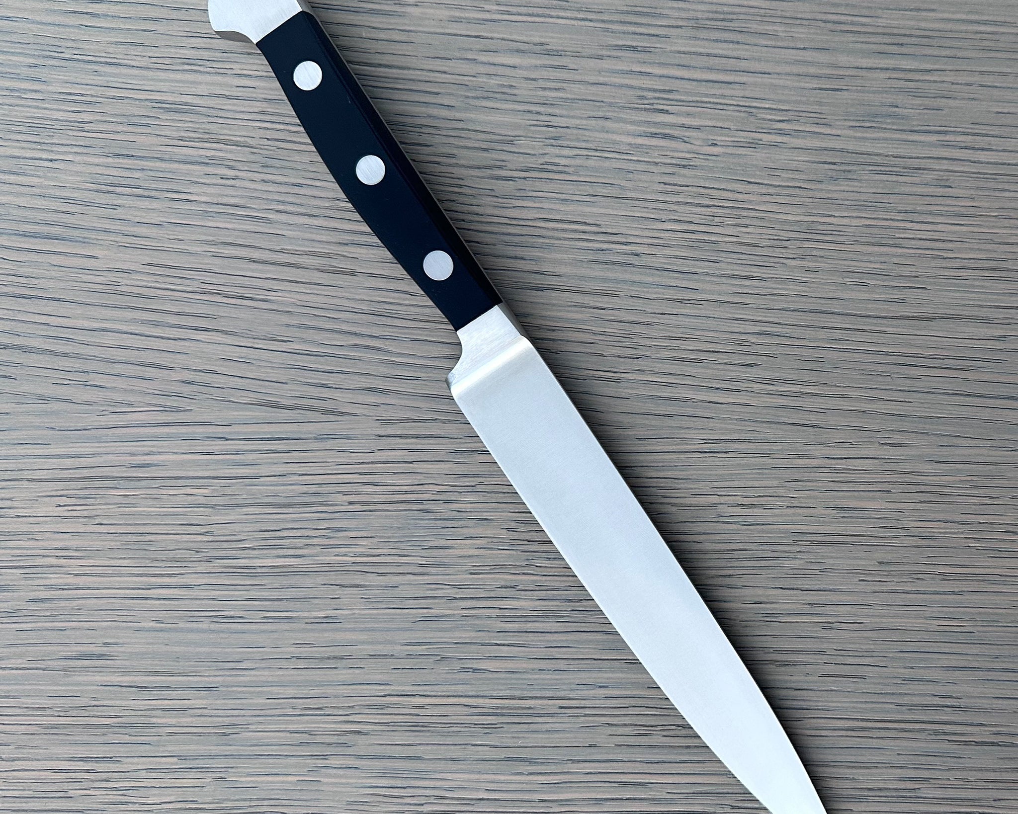 Güde Alpha Series 6-inch carving knife with black Hostaform handle