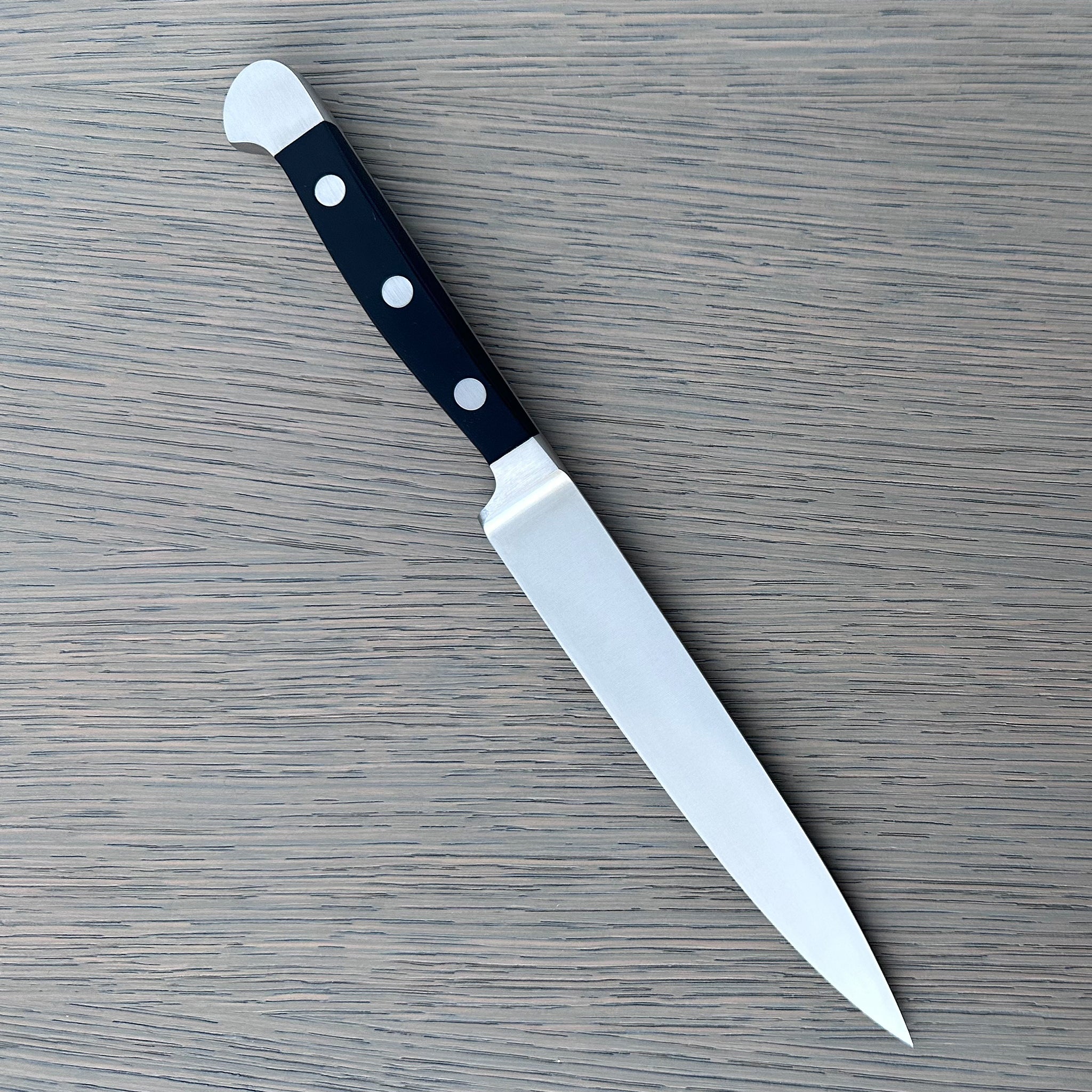 Güde Alpha Series 6-inch carving knife with black Hostaform handle