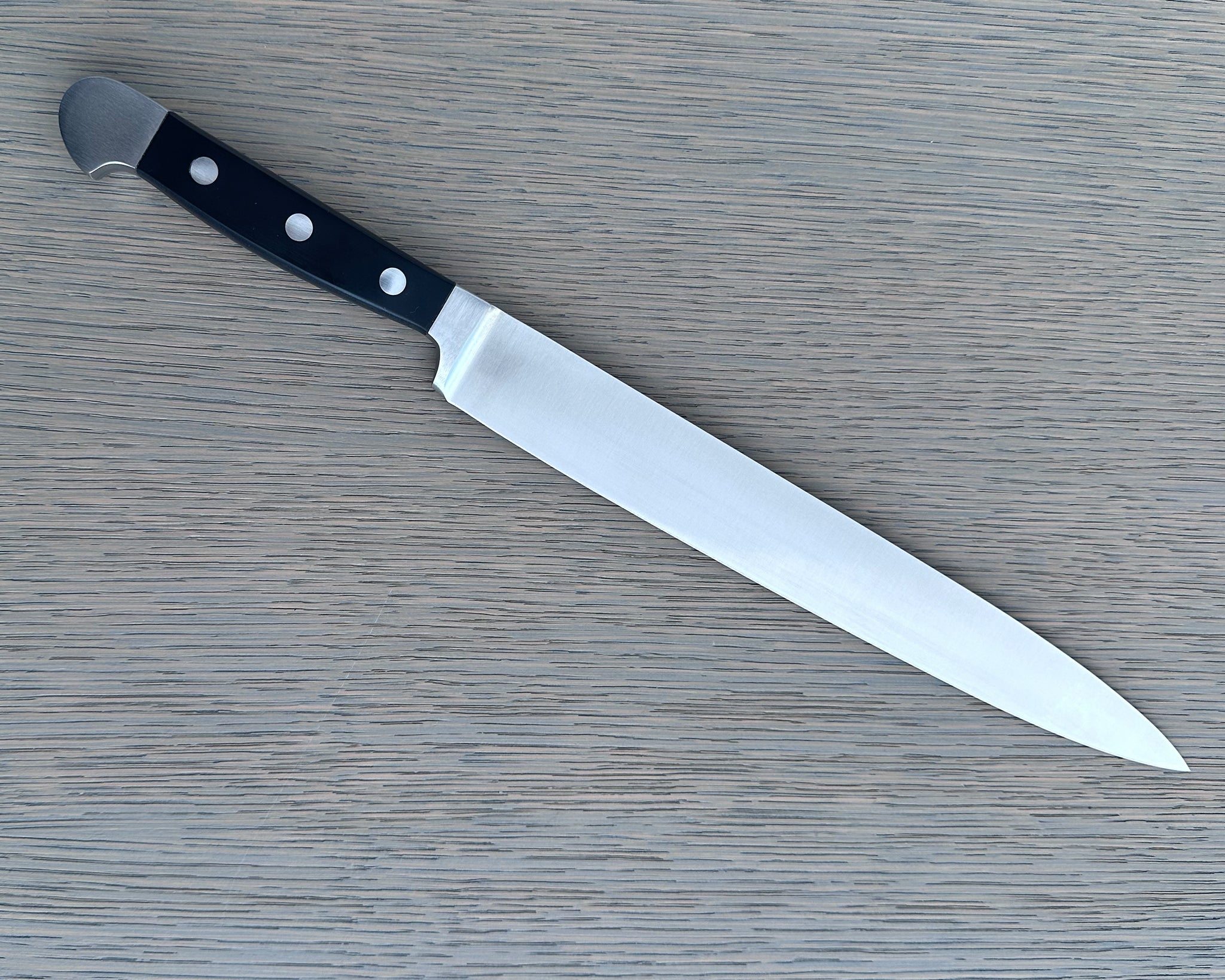 Güde Alpha Series 10-inch slicing knife with black Hostaform handle