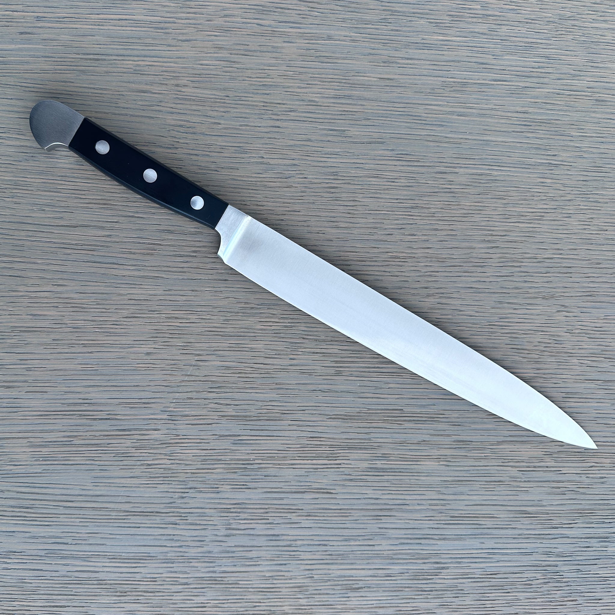 Güde Alpha Series 10-inch slicing knife with black Hostaform handle