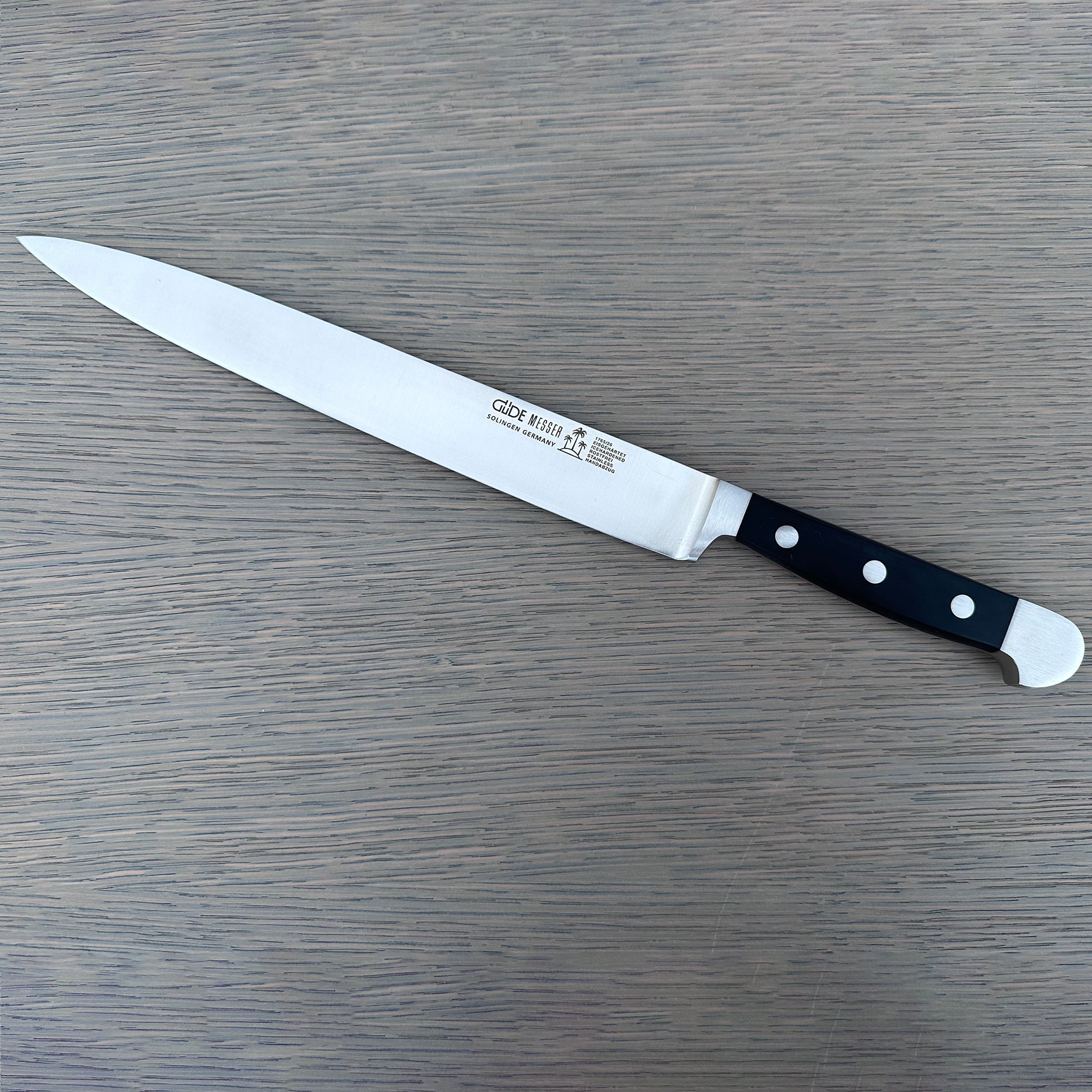Güde Alpha Slicing Knife 10-in with black Hostaform handle, hand-forged in Solingen, Germany