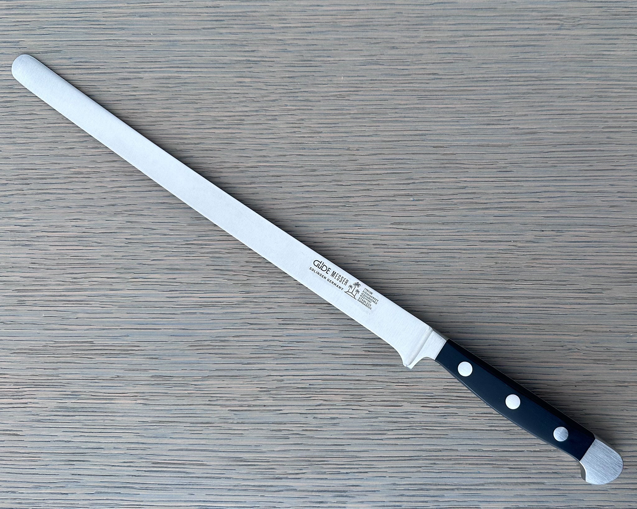 Güde Alpha Salmon Slicer 10-in with black Hostaform handle, hand-forged in Solingen, Germany