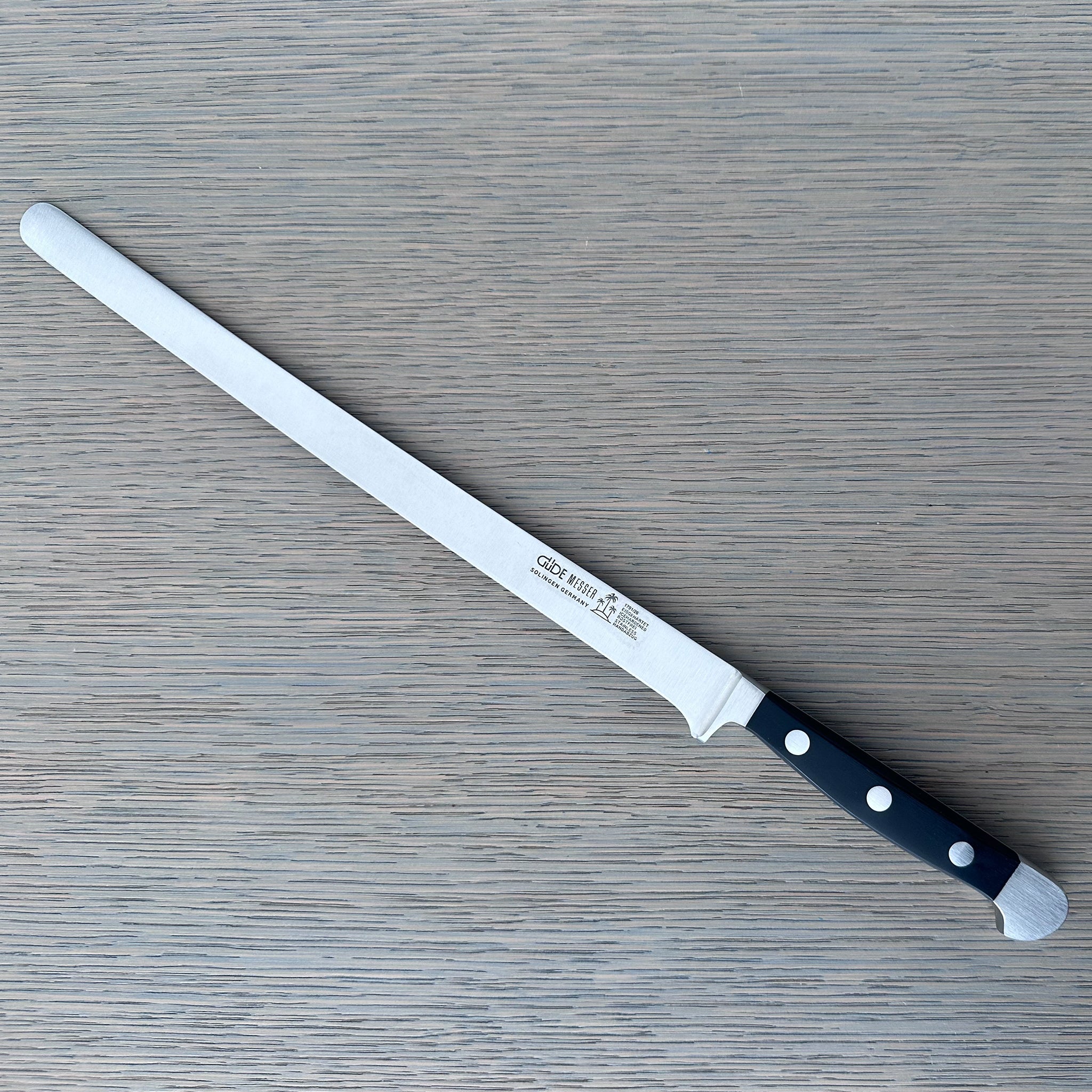 Güde Alpha Salmon Slicer 10-in with black Hostaform handle, hand-forged in Solingen, Germany