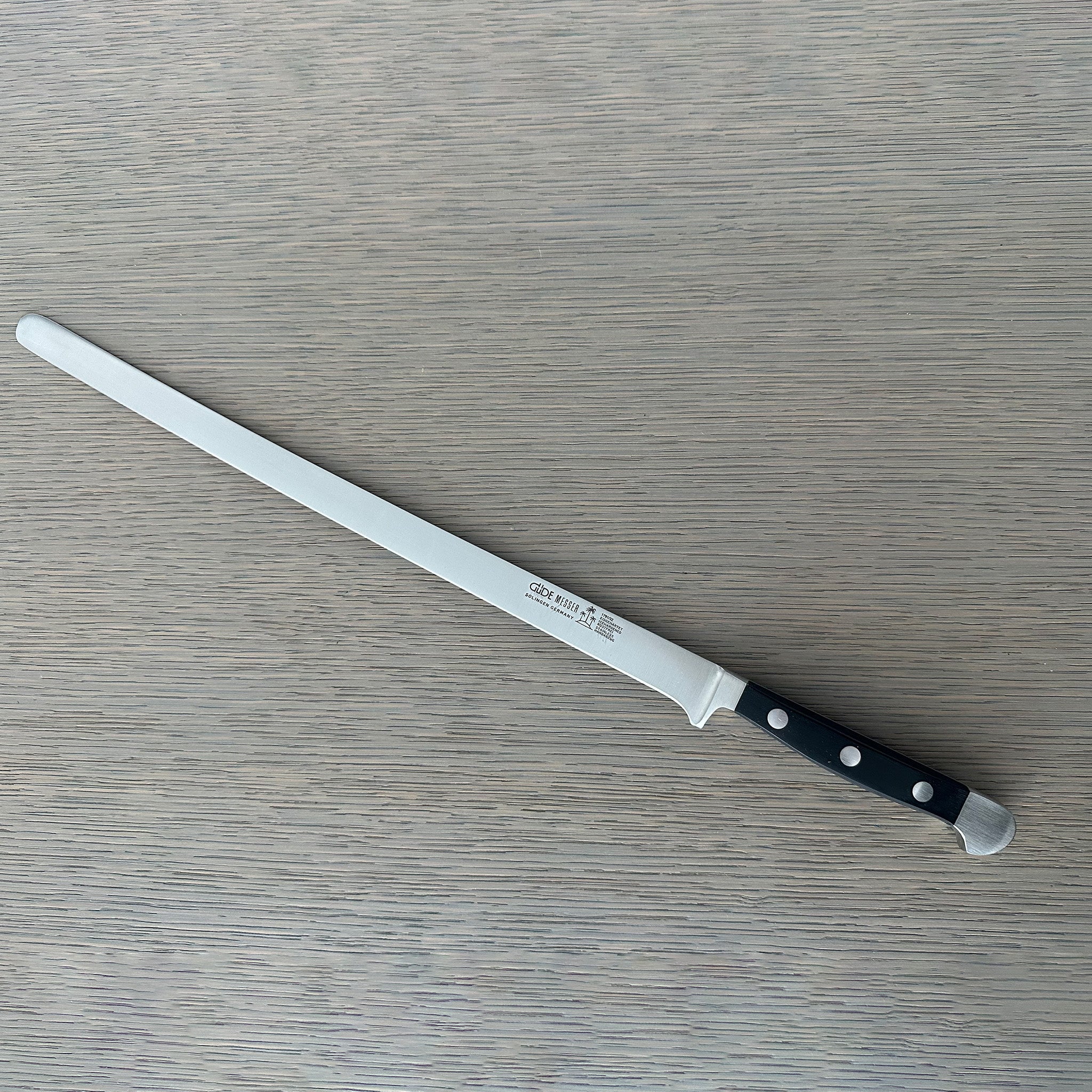 Güde Alpha Salmon Slicer 12-in with black Hostaform handle, hand-forged in Solingen, Germany