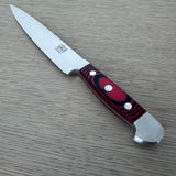 A Gude Micarta Slicing knife displayed diagonally on a light gray wood-grain surface.