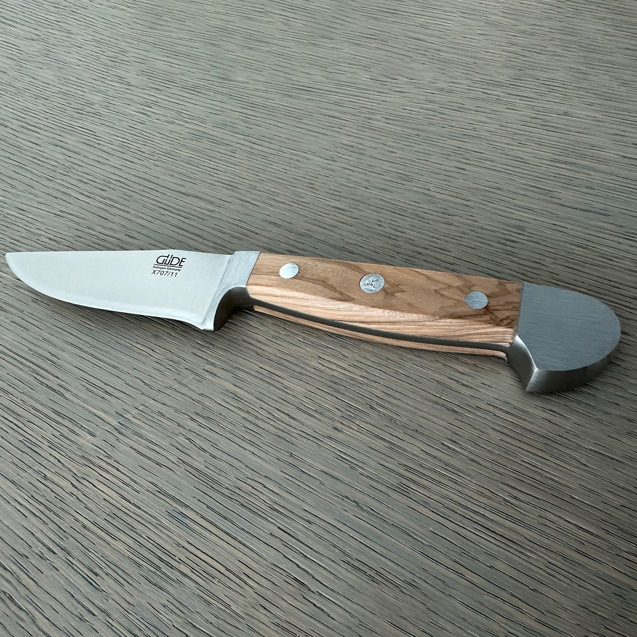Güde Alpha Olive Series Bavarian Utility Knife 4-inch, a premium-quality tool designed for the serious outdoorsman