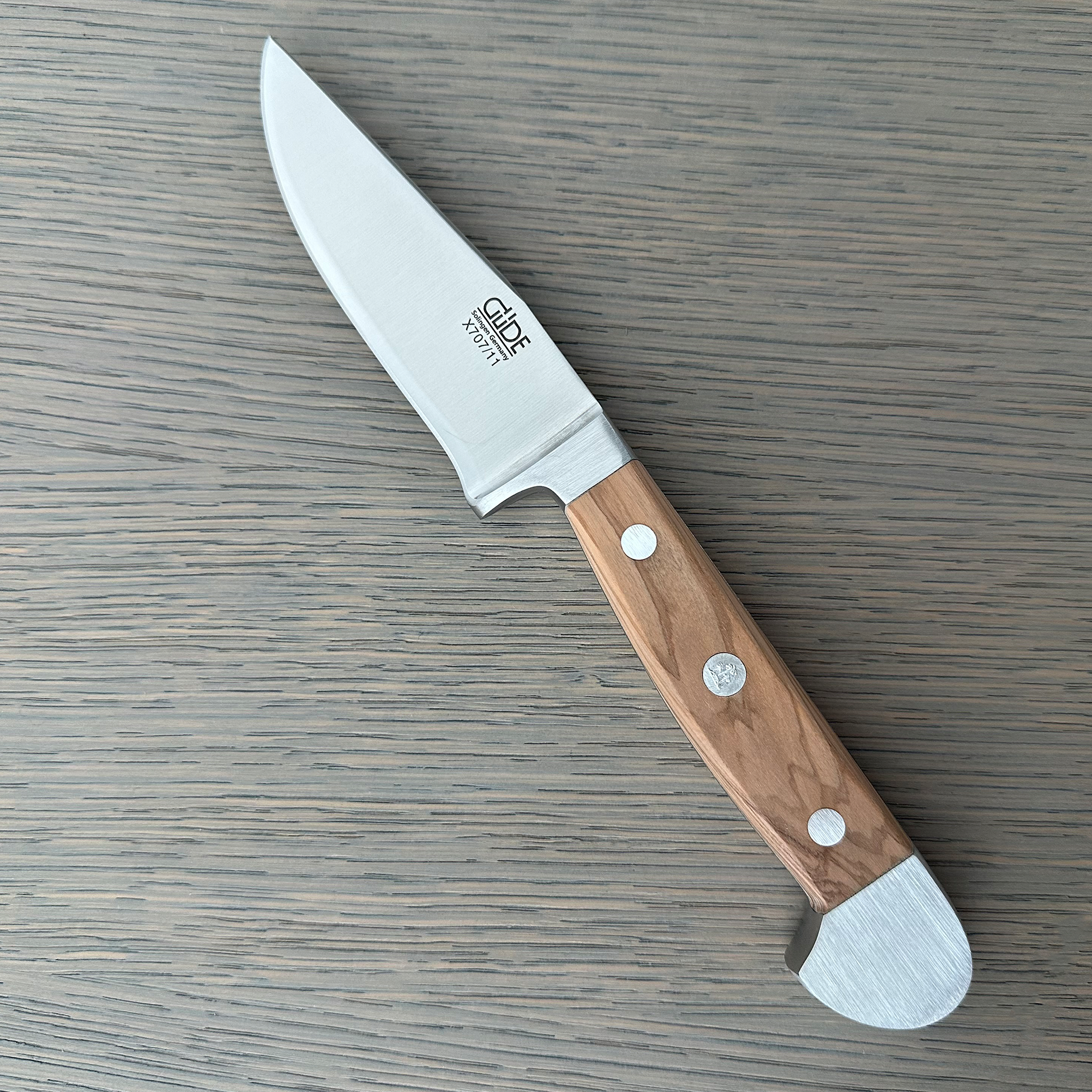 Güde Alpha Olive Series Bavarian Utility Knife 4-inch, forged from a single bar of steel for a harder, thicker blade