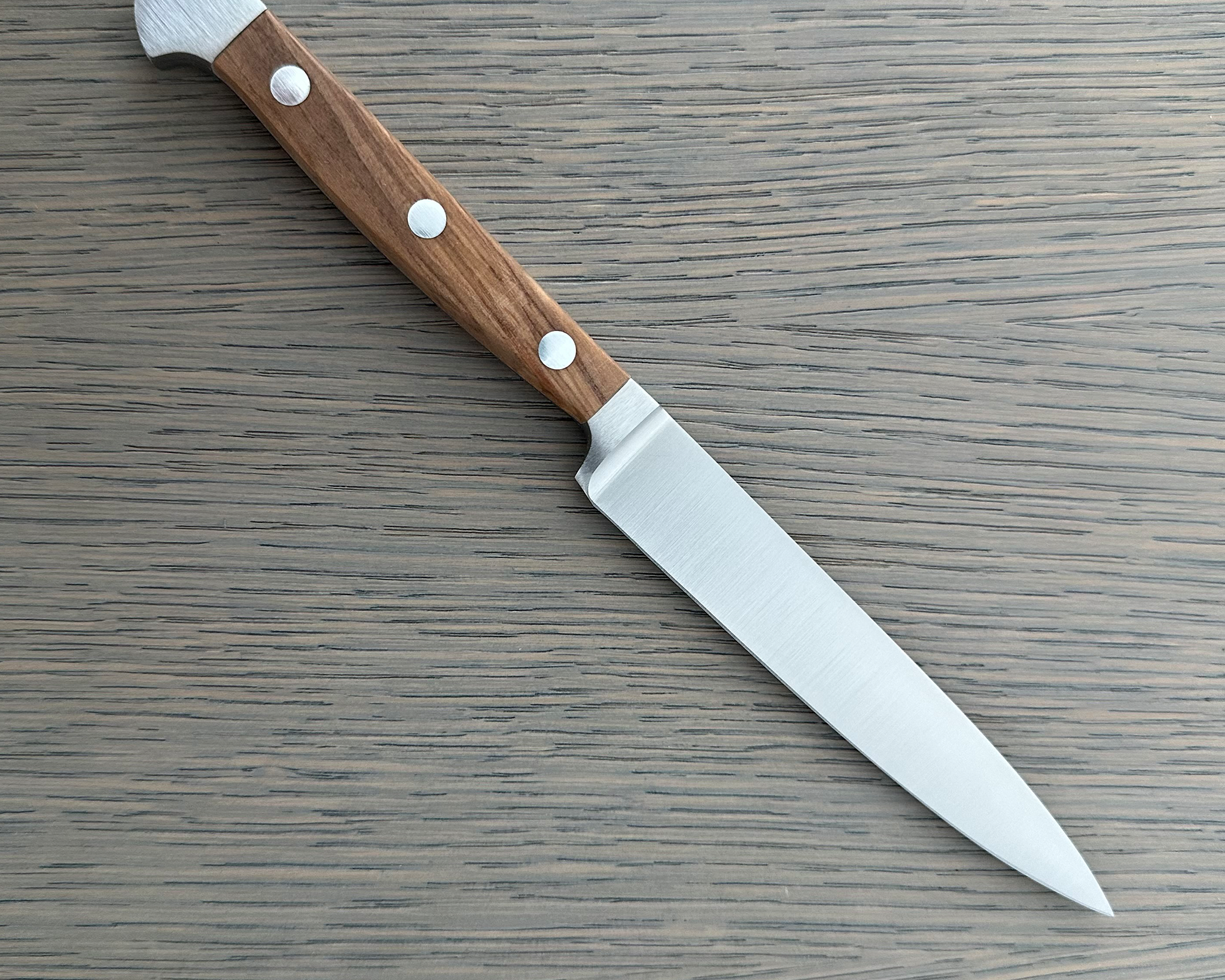 Güde Alpha Olive Series 5-inch Utility Knife with a forged blade and olivewood handle