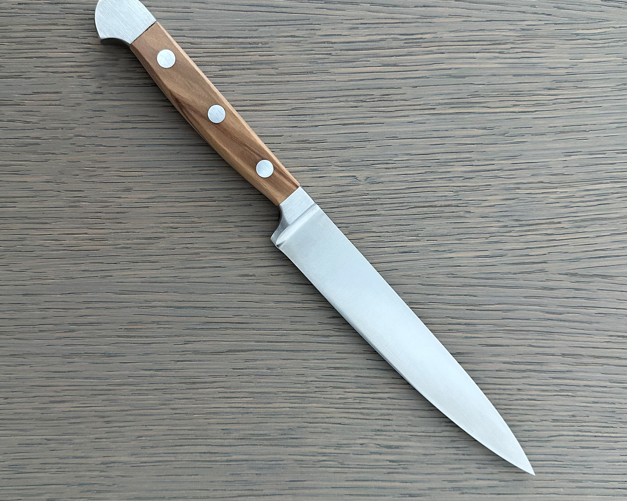 Güde Alpha Olive Series Slicing Knife 6-inch, forged from a single bar of steel for a harder, thicker blade